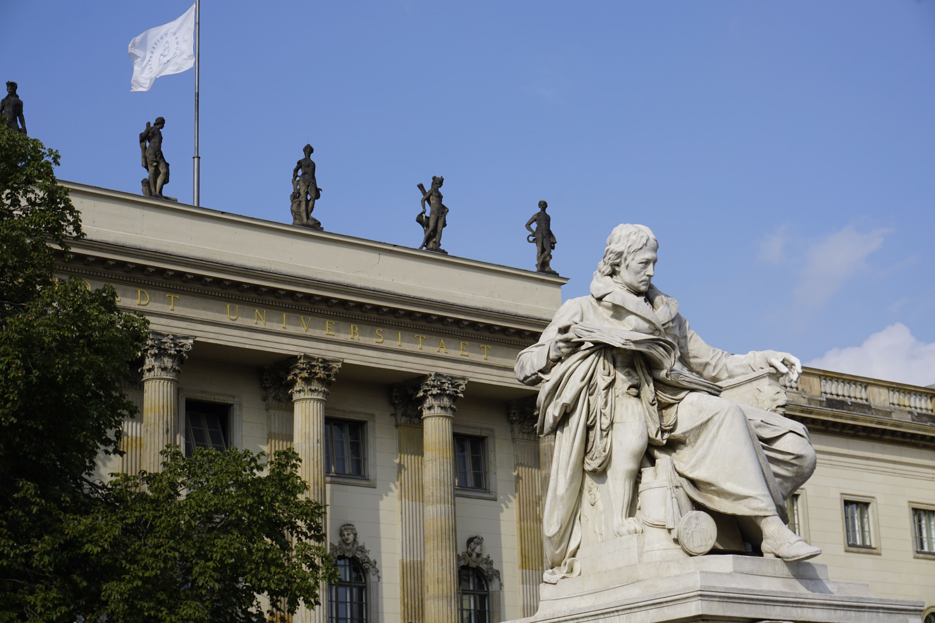 Historic university statue and campus facade in Germany
